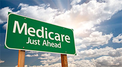 A road sign with the text, 'Medicare Just Ahead' printed on it.